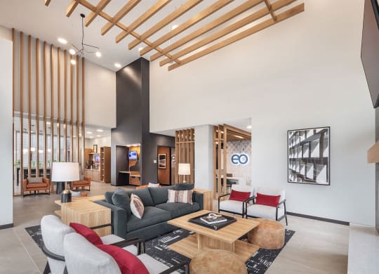 a living room with a couch and chairs and a table