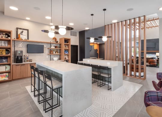 a kitchen and living room with a marble counter top