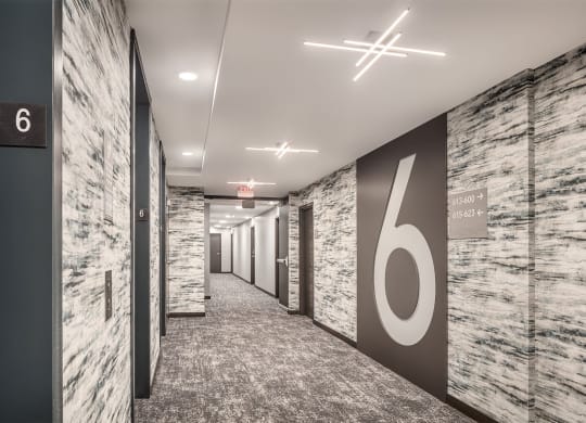 a hallway with a large number on the wall in a office