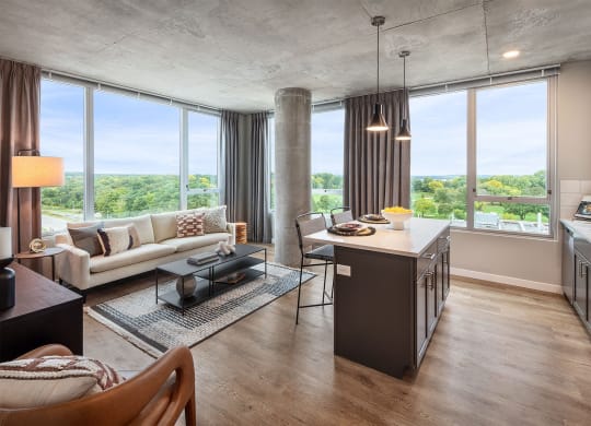 a living room and kitchen with a view of the city