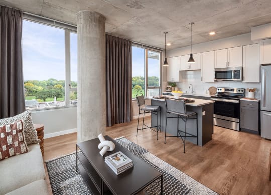 a living room with a kitchen and a dining room