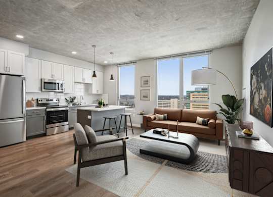 A modern kitchen with a refrigerator, oven, and microwave.