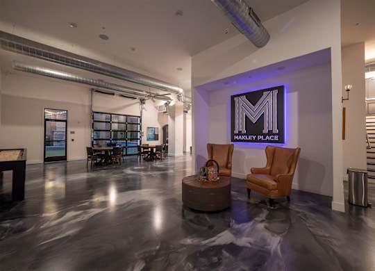 A spacious room with a Harley Place sign on the wall.