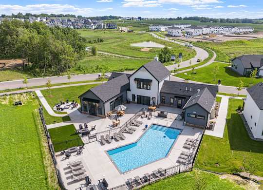 A large house with a pool in the backyard.