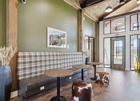 A room with a green wall and a checkered bench.
