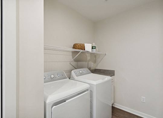 A laundry room with a washer and dryer.