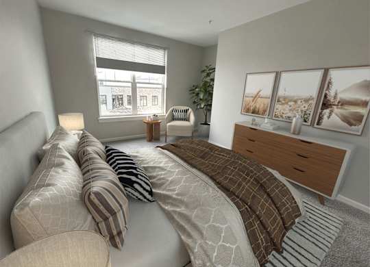 A bedroom with a large bed and a window overlooking a city street.