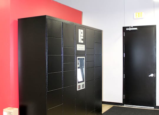 A black filing cabinet with a white label on it.