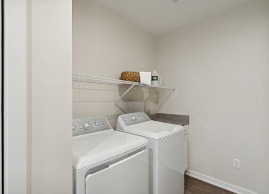 A laundry room with a washer and dryer.