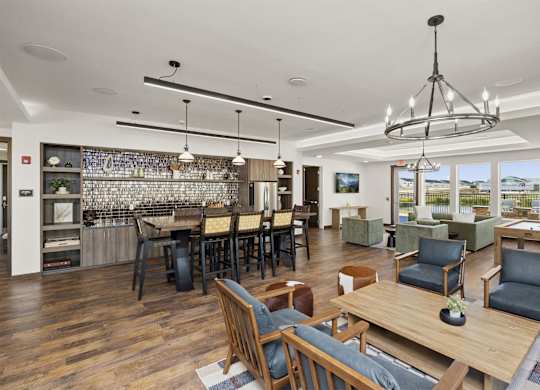 A modern living room with a dining area and kitchen in the background.