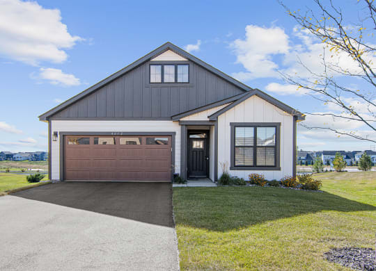 the front of a house with a garage door
