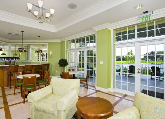 a living room filled with furniture and a large window at Arbor Oaks at Lakeland Hills, Florida, 33805