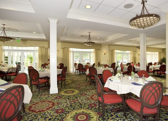 a large dining room with tables and chairs at Arbor Oaks at Lakeland Hills, Lakeland
