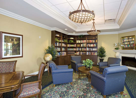 a lobby with couches and chairs and a fireplaceat Arbor Oaks at Lakeland Hills, Lakeland Florida 