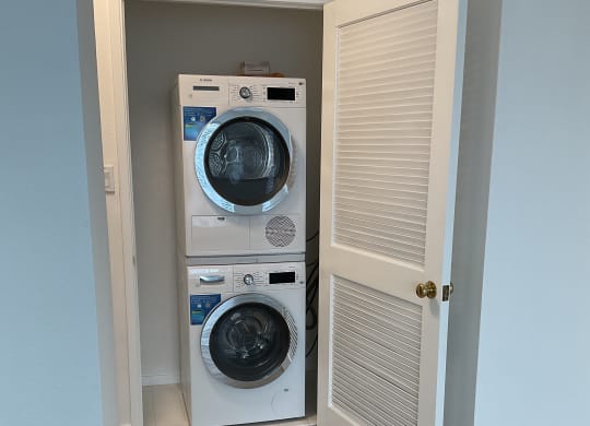 a small laundry room with a washer and dryer