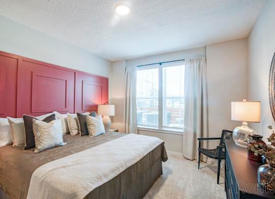 Bedroom with double window and ceiling fan at Tapestry Nona in Orlando, FL