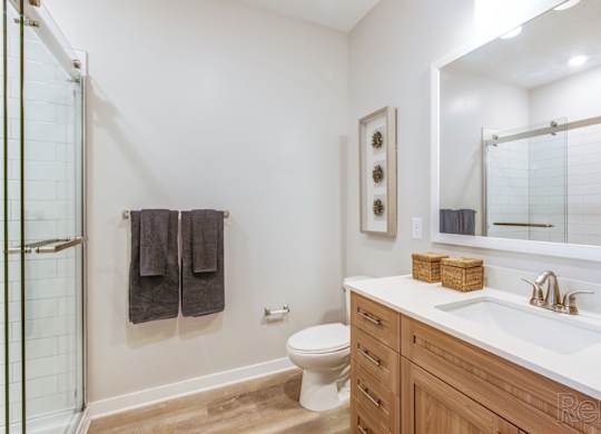 Primary bathroom with stand-up shower with glass doors at Tapestry Nona in Orlando, FL
