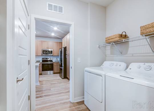 Full size washer/dryer in laundry room at Tapestry Nona in Orlando, FL