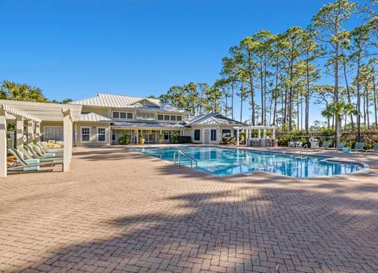 A large house with a pool in the backyard.