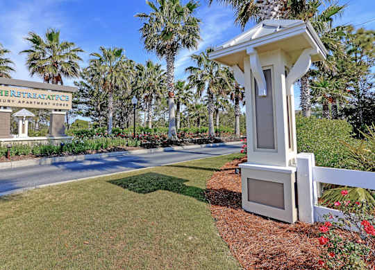 A sign for The Retreat Apartments is visible in the image.