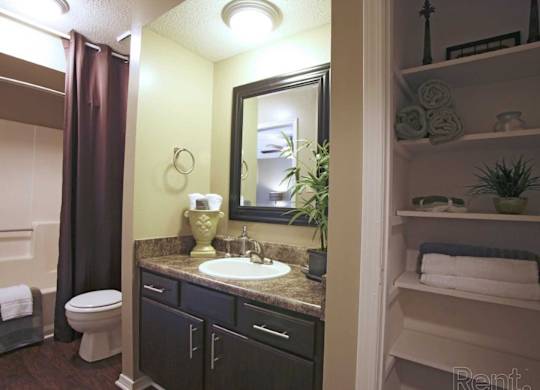en-suite bathroom with linen closet at The Oakley at Hillcrest in Mobile, AL