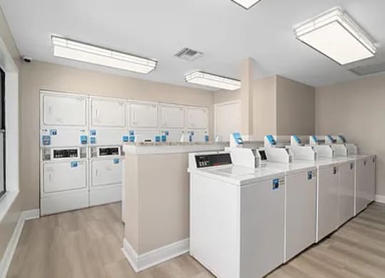 A laundromat with rows of washers and dryers.