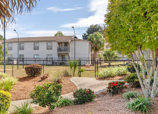 leash-free pet park and building exteriorat 701 South Apartments in Mobile, AL