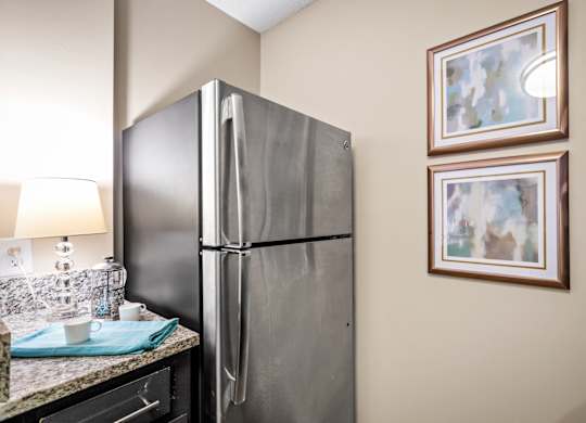 a kitchen with stainless steel appliances at 701 South Apartments in Mobile, AL