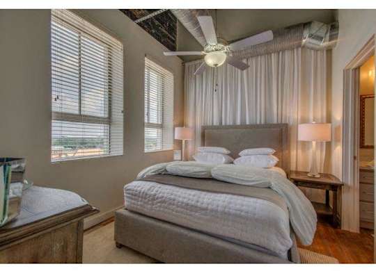 Bedroom With Expansive Windows at The Tower Apartments, Tuscaloosa, AL, 35401