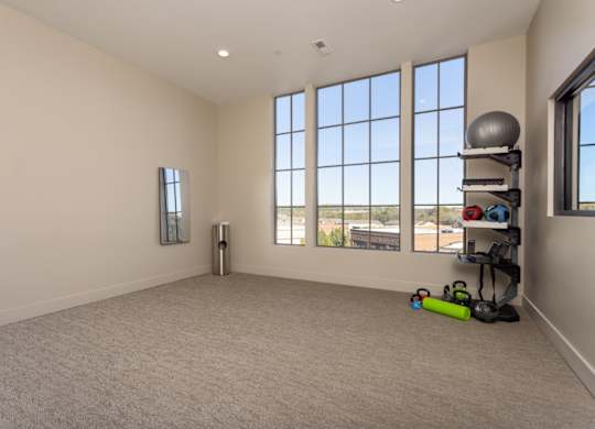 yoga room with large windows at 2020 Providence in Huntsville, AL