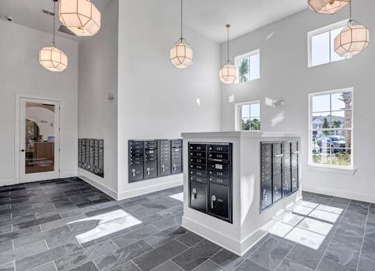 A modern kitchen with a black fridge and stove.