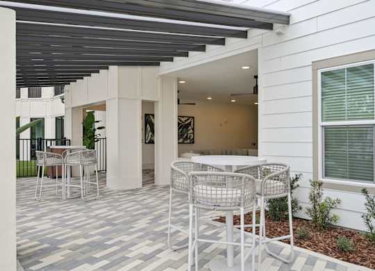 Social area with bar top tables at Tapestry University Park Apartments in Sarasota, FL