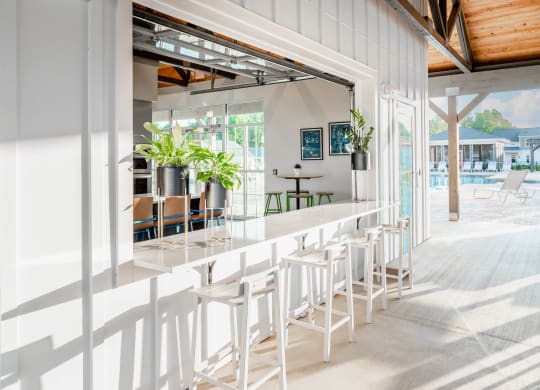 Resident social lounge with bar at Anthem Luxury Rentals and Apartment Homes in Huntsville, AL