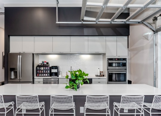 indoor/outdoor social club and bar with kitchen at Anthem Apartments and Cottages in Huntsville, Alabama