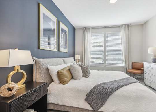 the preserve at ballantyne commons bedroom with large bed and windows