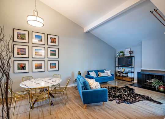 A living room with a fireplace at Saddlebrook at Tates Creek Apartments in Lexington, KY