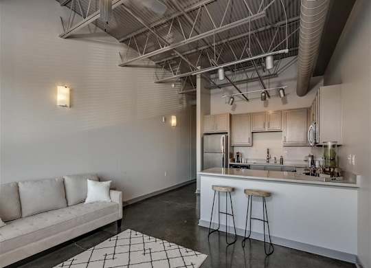 Living Rom With Kitchen Area at The Tower Apartments, Tuscaloosa, 35401