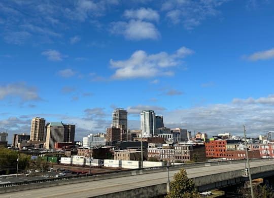 A cityscape view from the Fitzroy Apartments with a bridge in the foreground and downtown skyline in Birmingham Alabama.