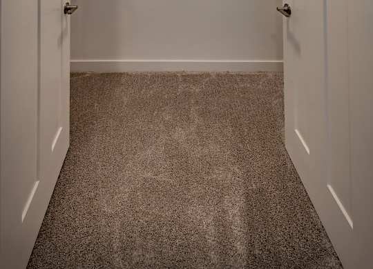 Spacious closet space with french doors and wire shelving at Wesley Place Apartments in Indianapolis, IN
