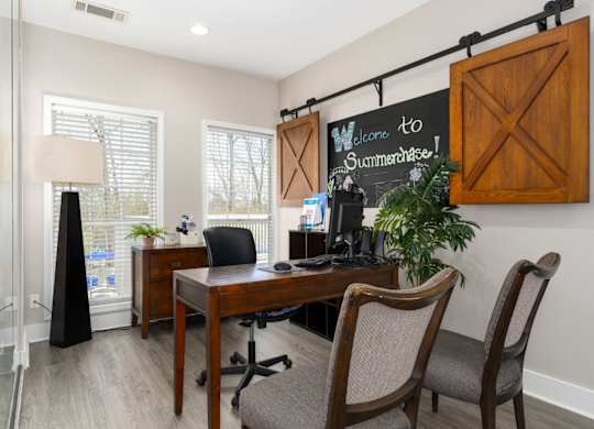 Leasing office desk, wood floors and seating in Summerchase at Riverchase in Hoover, Alabama