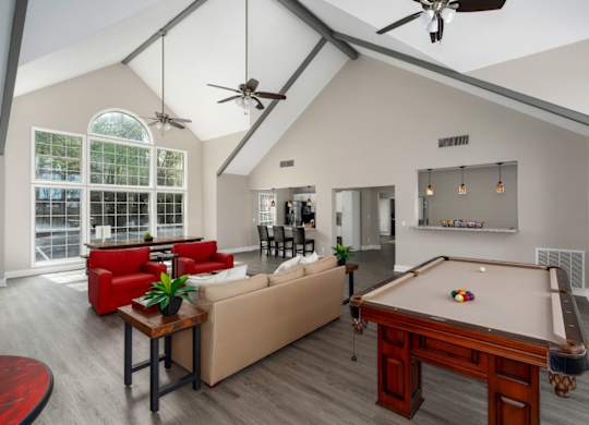 Clubhouse featuring seating and a pool table at Summerchase at Riverchase in Hoover, Alabama