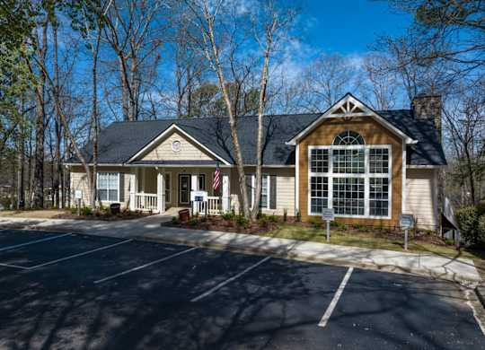 Clubhouse and parking surrounded by trees at Summerchase at Riverchase in Hoover, Alabama