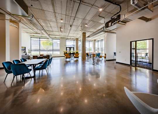 Clubhouse with a conference table and chairs at Wesley Place Apartments in Indianapolis, IN