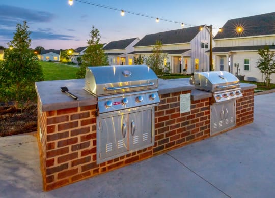 two stainless steel barbecue grills at Anthem Apartments and Cottages in Huntsville, Alabama