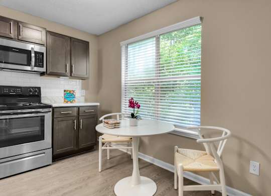 A dining table near the window in the kitchen at Crystal Lake in Pensacola, Florida.