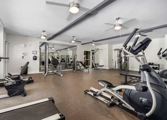 Fitness center with ceiling fans and exercise equipment at Summerchase at Riverchase in Hoover, Alabama