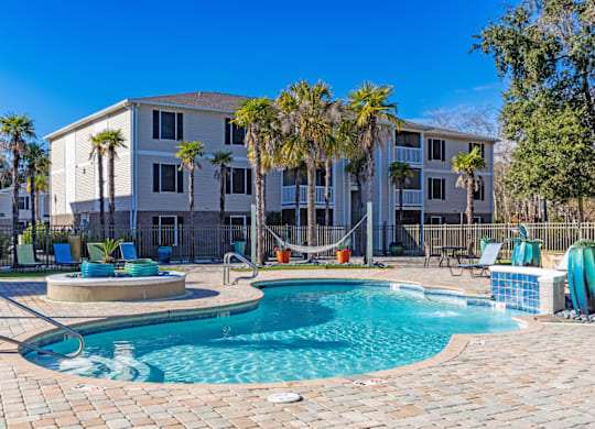 Resort-style swimming pool and sundeck at Grande View Apartments in Biloxi, MS