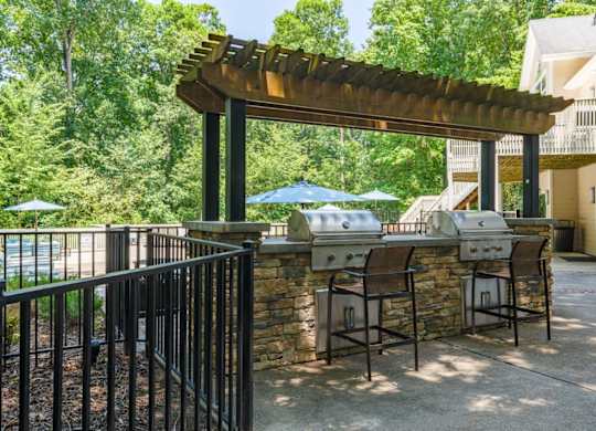 A pergola with two gas grills at Summerchase at Riverchase in Hoover, Alabama.