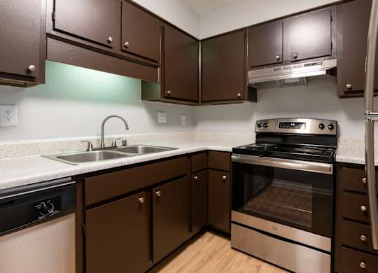 Kitchen with stainless steel appliances at Saddlebrook at Tates Creek Apartments in Lexington, KYL