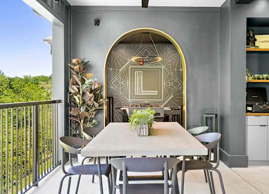 A modern dining area with a table set for four.